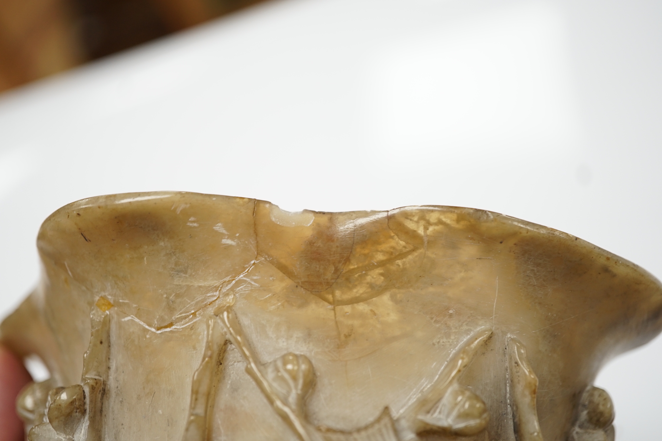 A Chinese carved soapstone libation cup, late 19th century and an elm cased inkstone